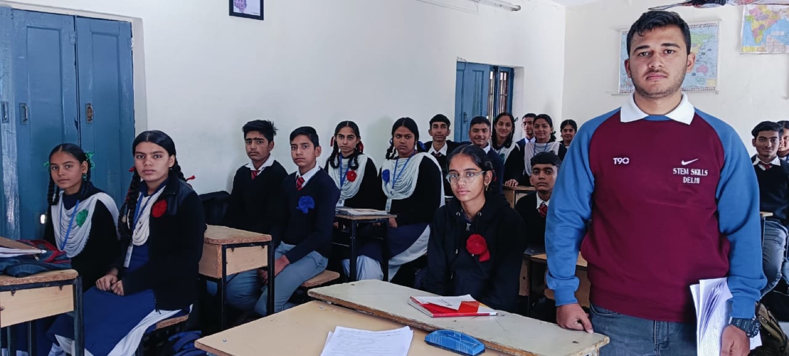 A StemSkills instructor teaching a classroom of students in uniform